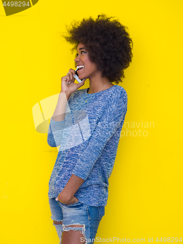Image of young black Woman Using mobile phone