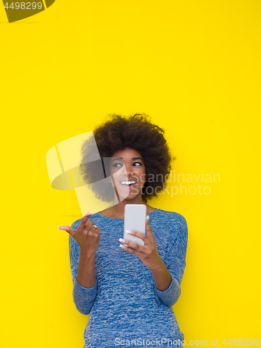 Image of young black Woman Using mobile phone