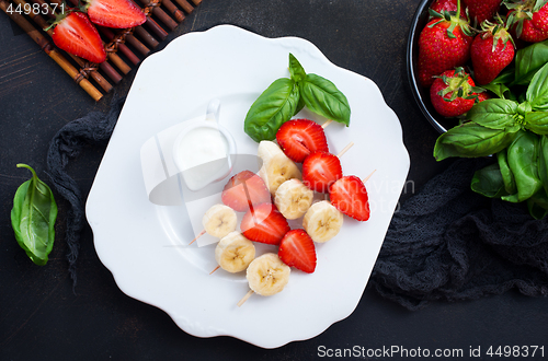 Image of banana with strawberry