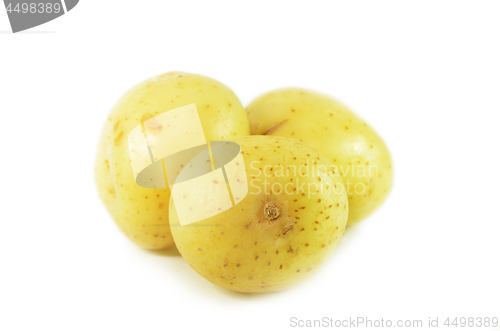 Image of Three whole raw potatoes