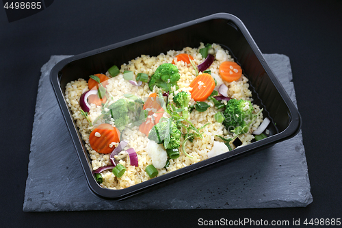 Image of Dietary catering, rice with vegetables packed in a box.