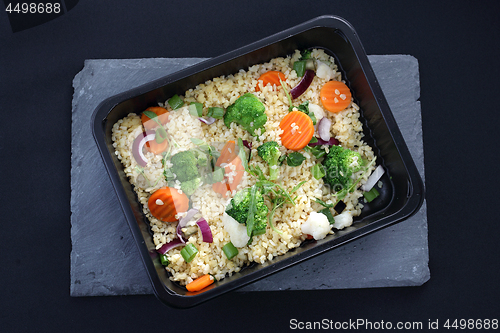 Image of Dietary catering, rice with vegetables packed in a box.