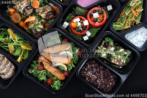 Image of Lunch boxes, delicious and healthy dinner dishes. Food with delivery. Menu suggestions in catering with delivery.