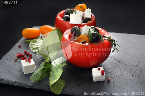 Image of Colorful starter. Vegetable appetizer. Stuffed tomatoes.