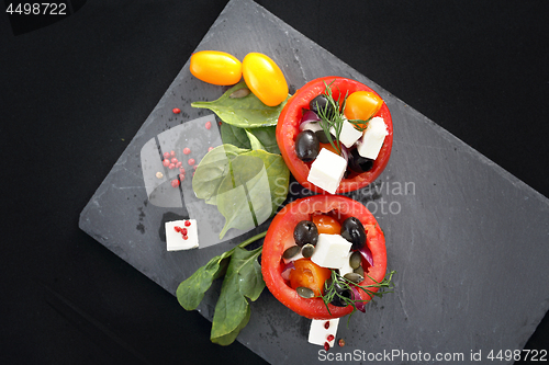 Image of Prepared dish, stuffed tomatoes with pink yoghurt sauce