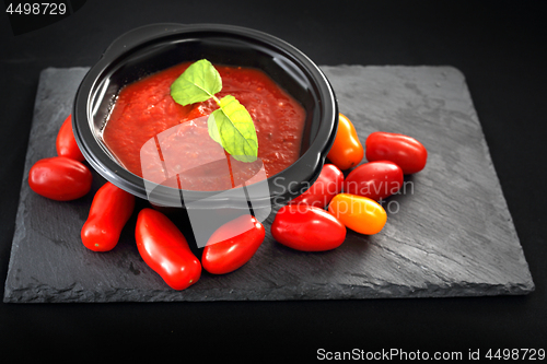 Image of Tomato cream soup in a disposable container.