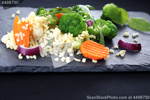 Image of Light diet, rice with broccoli and carrots.