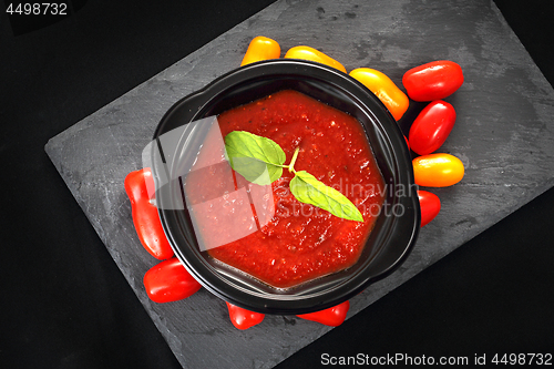 Image of Tomato cream soup in a disposable container.