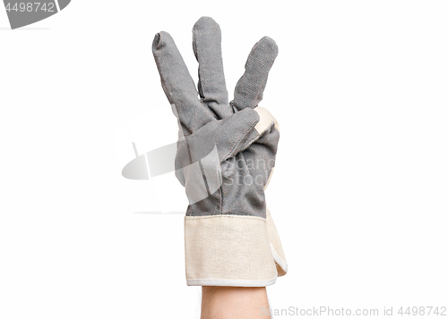 Image of Male hand wearing working glove