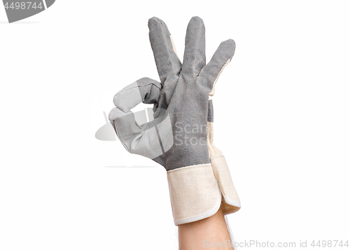 Image of Male hand wearing working glove