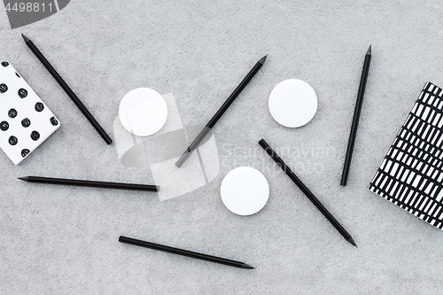 Image of Blank badges and sharp black pencils