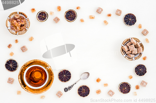 Image of Frame made of tea, sugar and dried lemon slices