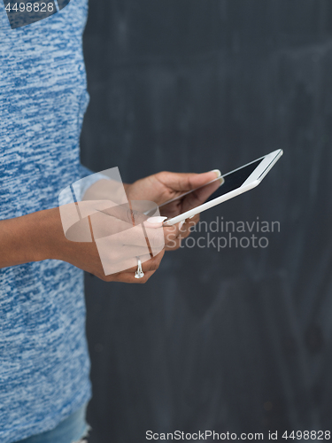 Image of Happy African American Woman Using Digital Tablet