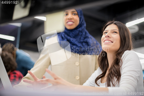 Image of multiethnics team of software developers working together