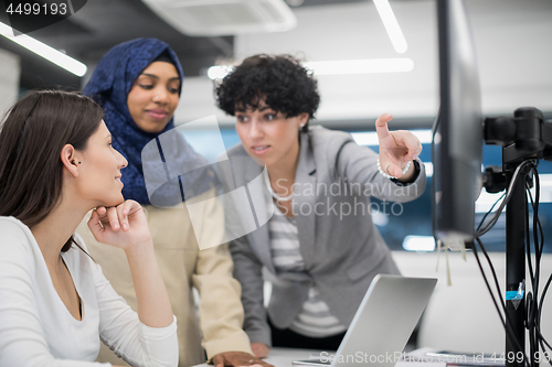 Image of multiethnics team of software developers working together