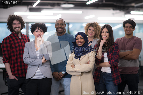 Image of portrait of young excited multiethnics business team