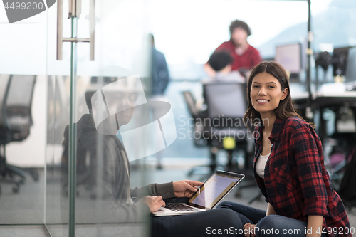 Image of software developers couple working on the floor