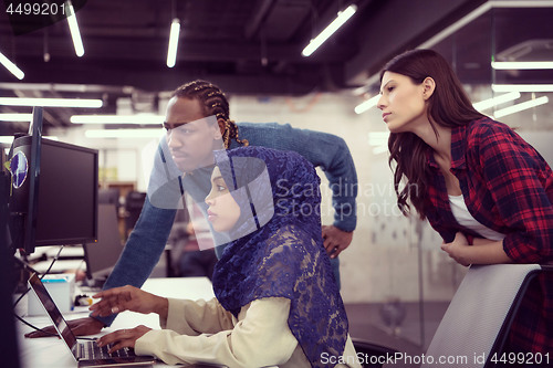 Image of multiethnics team of software developers working together