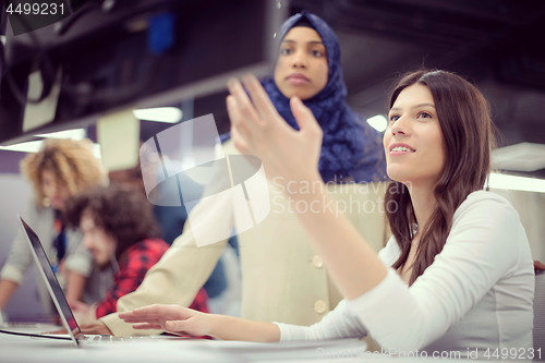 Image of multiethnics team of software developers working together