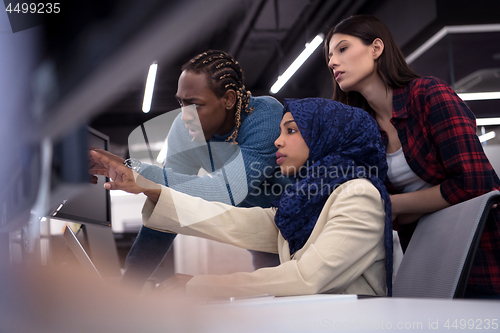 Image of multiethnics team of software developers working together