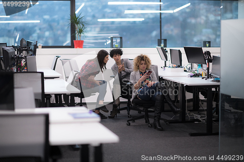 Image of female software developers using mobile phones