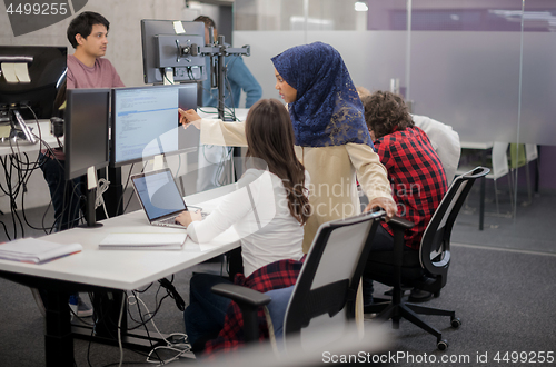 Image of multiethnics team of software developers working together