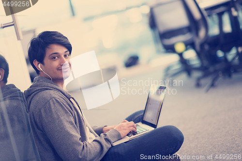 Image of software developer working on the floor