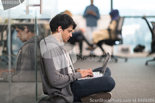 Image of software developer working on the floor