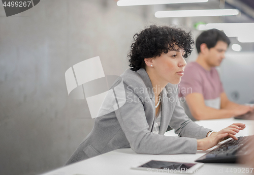 Image of female software developer using desktop computer