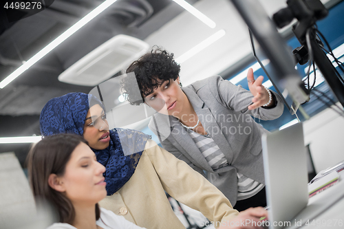 Image of multiethnics team of software developers working together