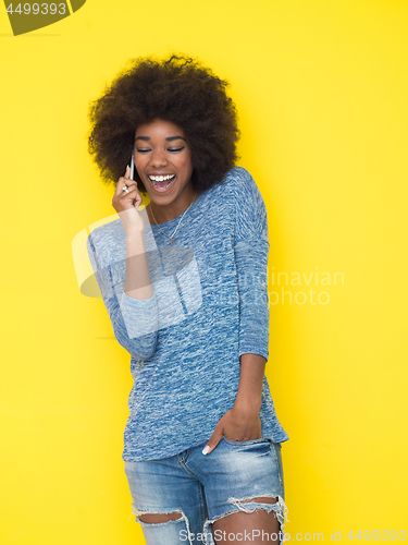 Image of young black Woman Using mobile phone