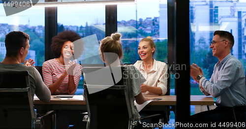 Image of Multiethnic startup business team in night office