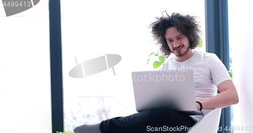 Image of man drinking coffee enjoying relaxing lifestyle