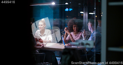Image of Multiethnic startup business team in night office