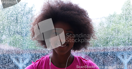 Image of portrait of young afro american woman in gym