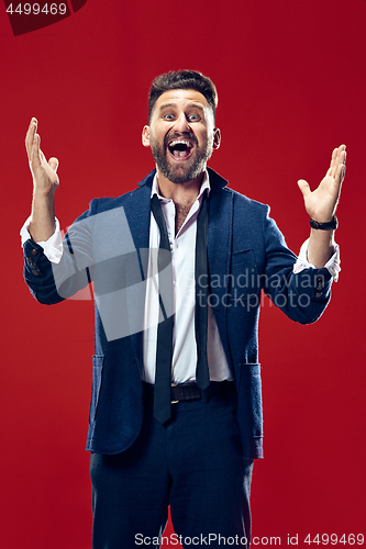 Image of Winning success man happy ecstatic celebrating being a winner. Dynamic energetic image of male model