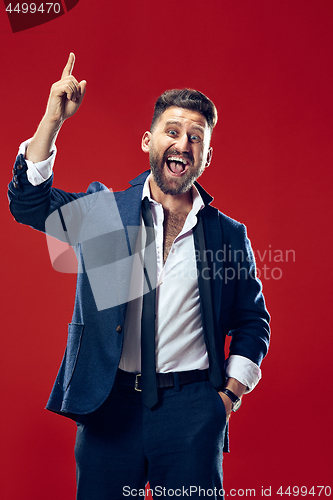 Image of Winning success man happy ecstatic celebrating being a winner. Dynamic energetic image of male model