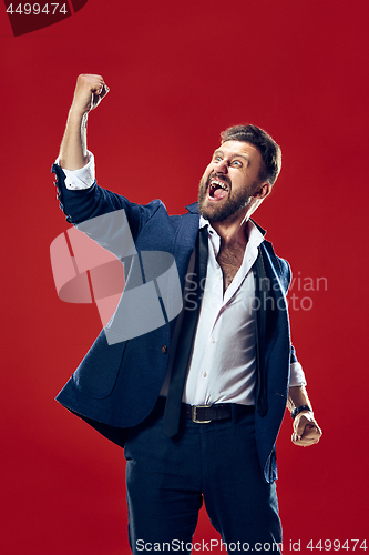 Image of Winning success man happy ecstatic celebrating being a winner. Dynamic energetic image of male model