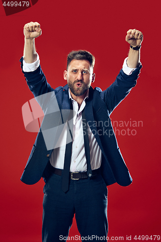 Image of Winning success man happy ecstatic celebrating being a winner. Dynamic energetic image of male model