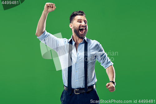 Image of Winning success man happy ecstatic celebrating being a winner. Dynamic energetic image of male model