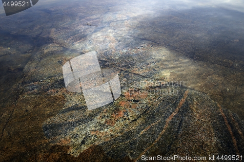 Image of granite slab under the surface of the water