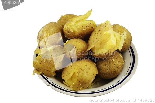 Image of crumbly jacket potatoes in a plate on a white