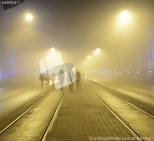 Image of walk along the pavement on the night street in Helsink