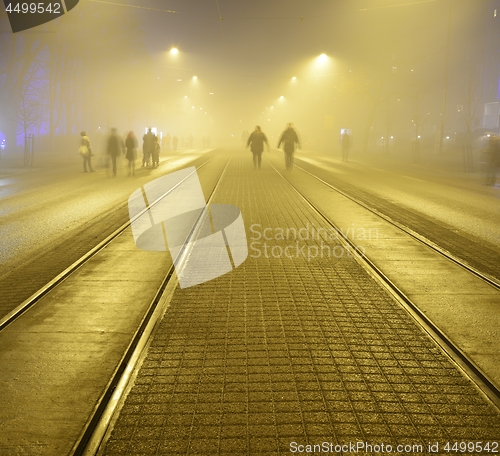 Image of walk along the pavement on the night street in Helsink