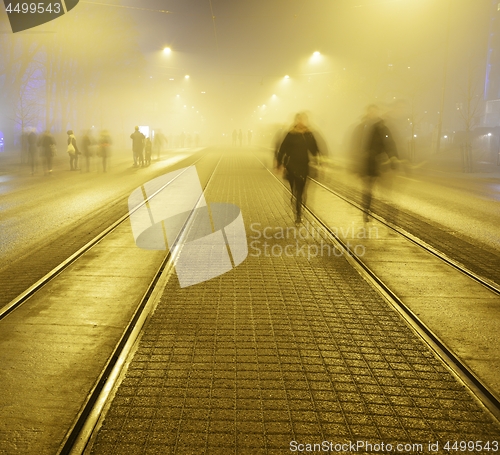 Image of walk along the pavement on the night street in Helsink