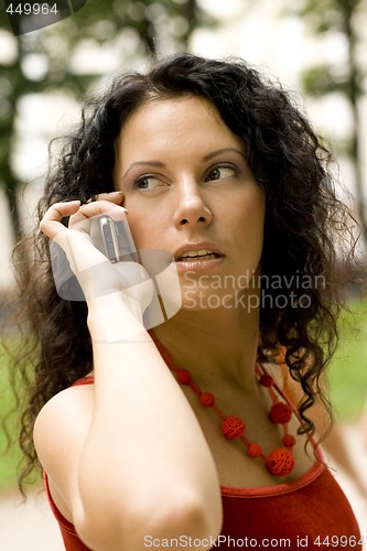 Image of pretty woman using mobile phone