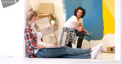 Image of Happy couple doing home renovations