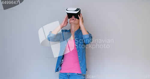 Image of girl using VR headset glasses of virtual reality