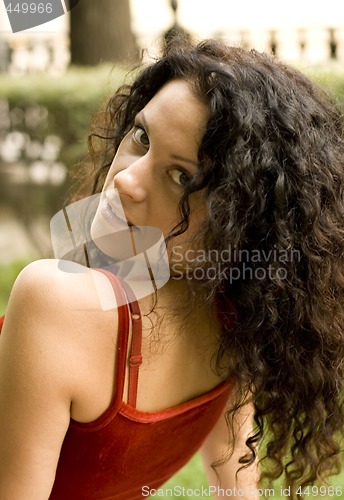 Image of beautiful brunet woman in red