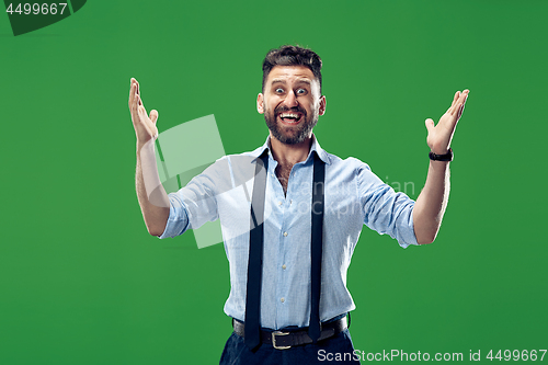 Image of Winning success man happy ecstatic celebrating being a winner. Dynamic energetic image of male model